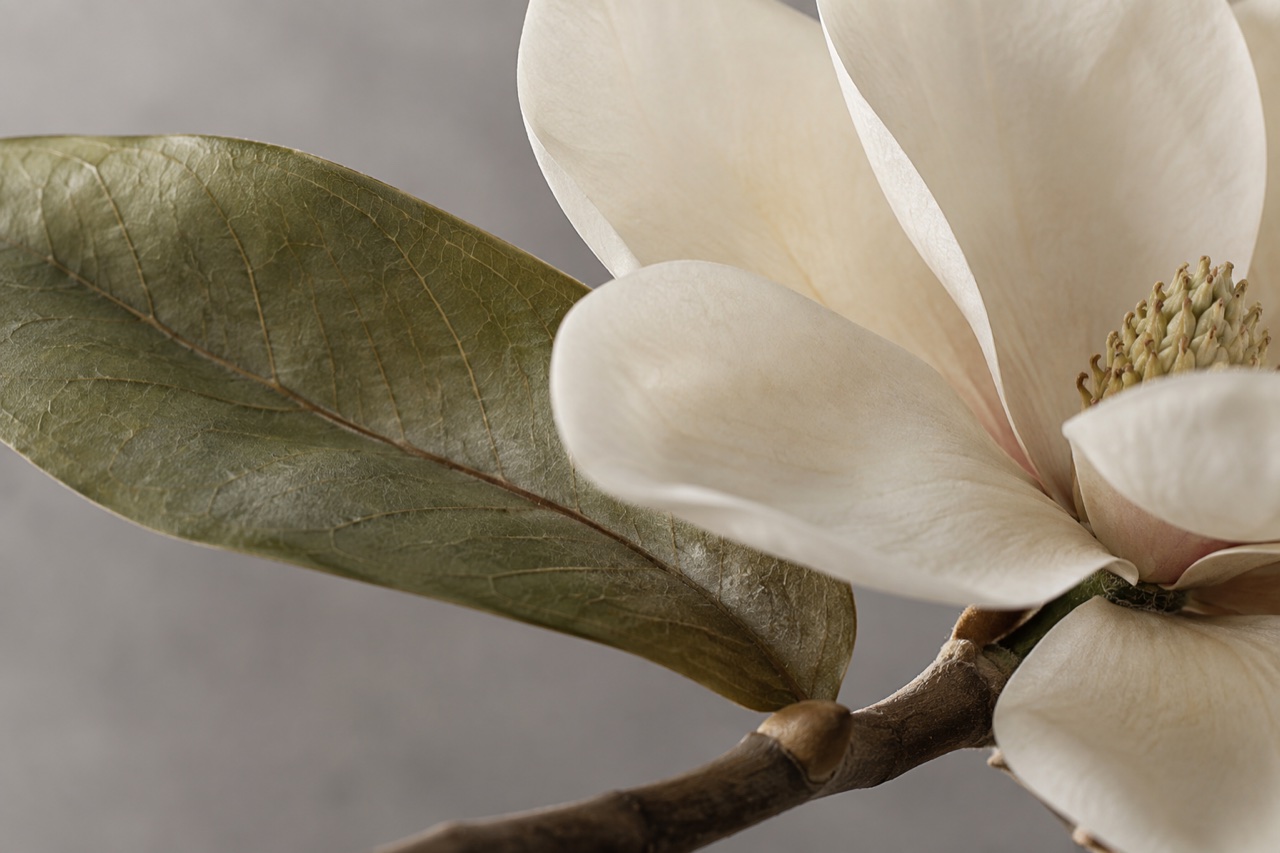 Macro view of textile petals, molded leaf veins and a wrapped stem
